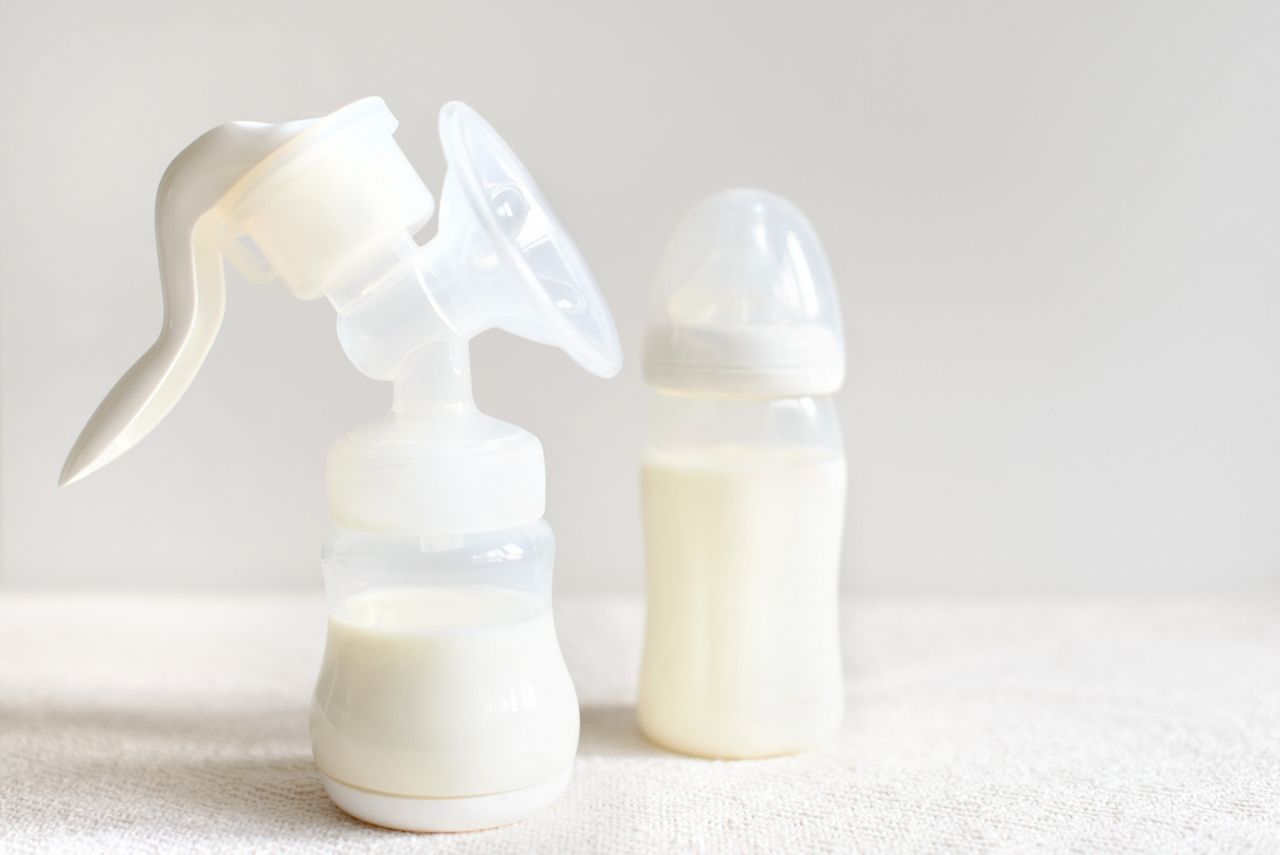Breast pump and bottle with milk for baby; Shutterstock ID 746826415; purchase_order: DNC Thumbnails; job: Publications; client: ; other: 