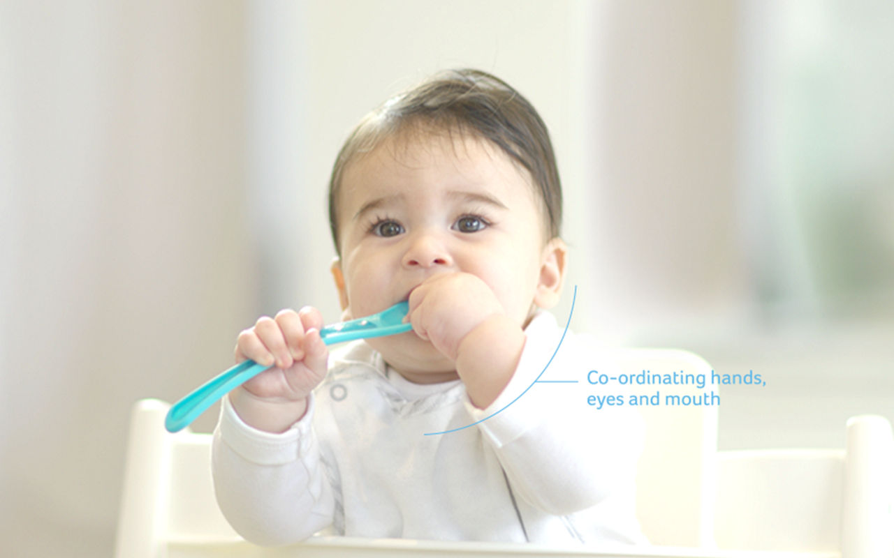 baby weaning hands eye and mouth