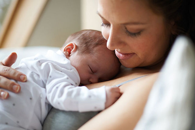 sleeping baby on mothers chest 1