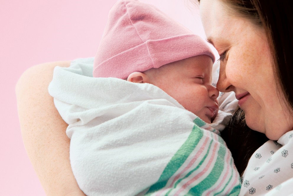 Mum hugging baby