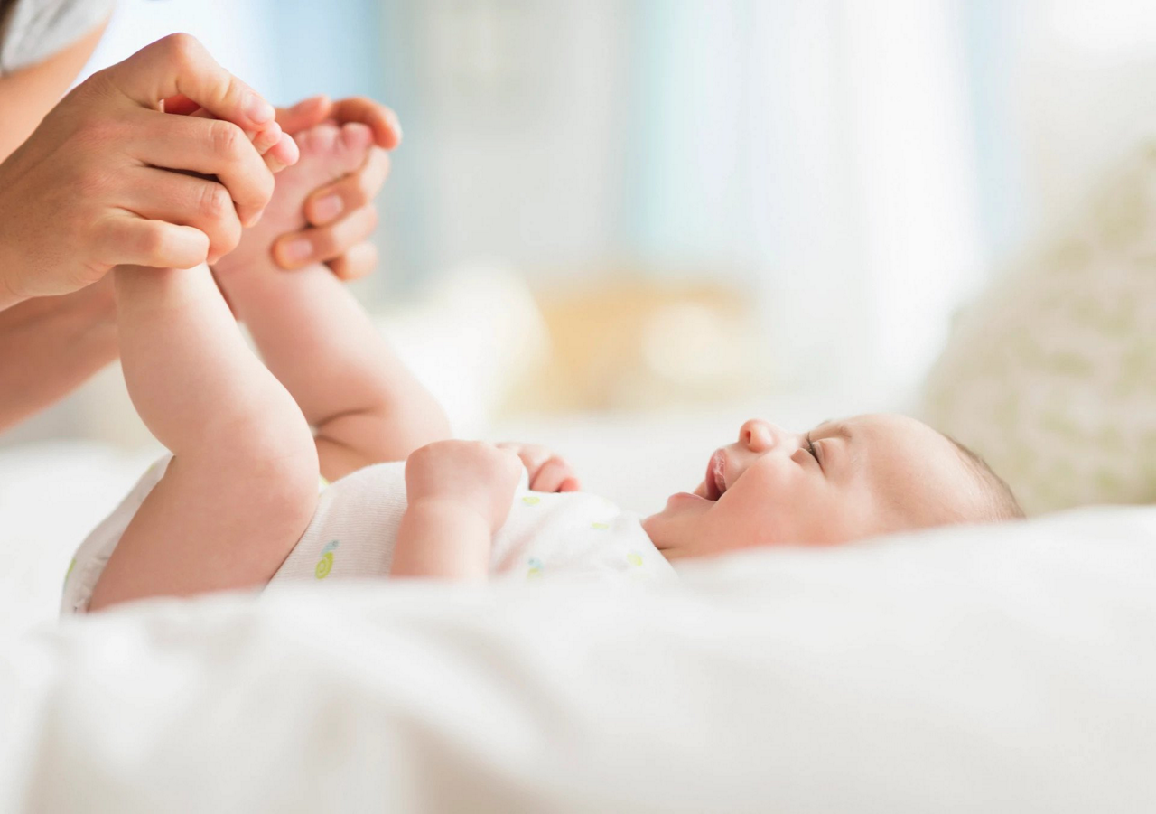 baby with feet in the air