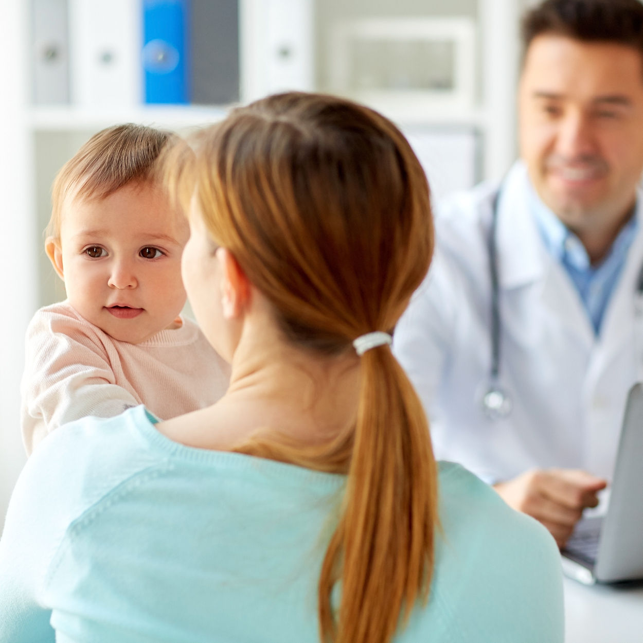 Toddler and mother at a GP appointment