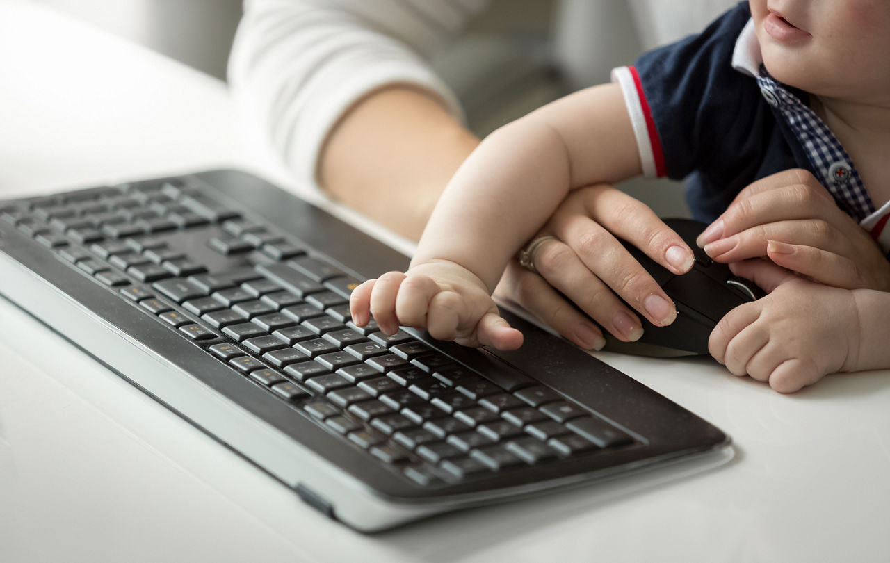 Toddler at computer keyboard