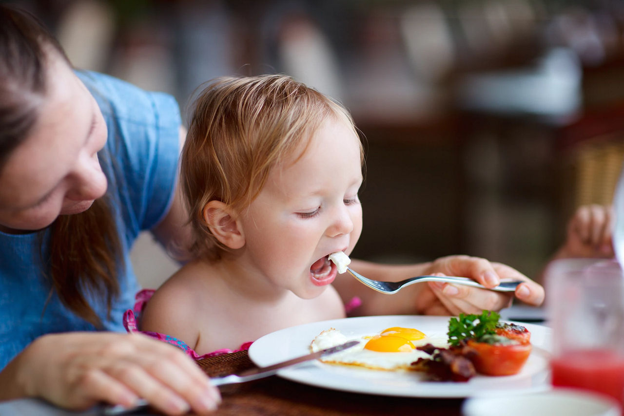 Toddler Eating Egg