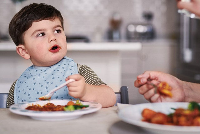 toddler having dinner