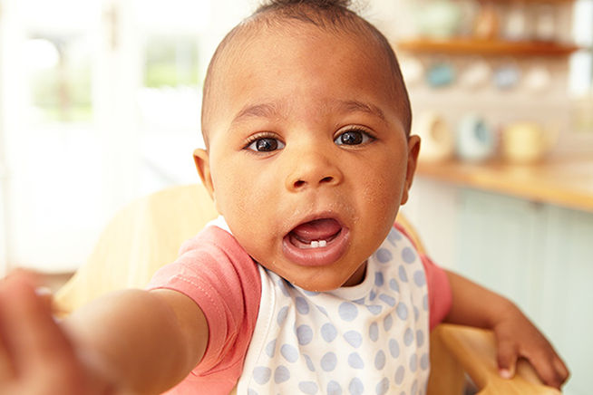 toddler reaching to camera