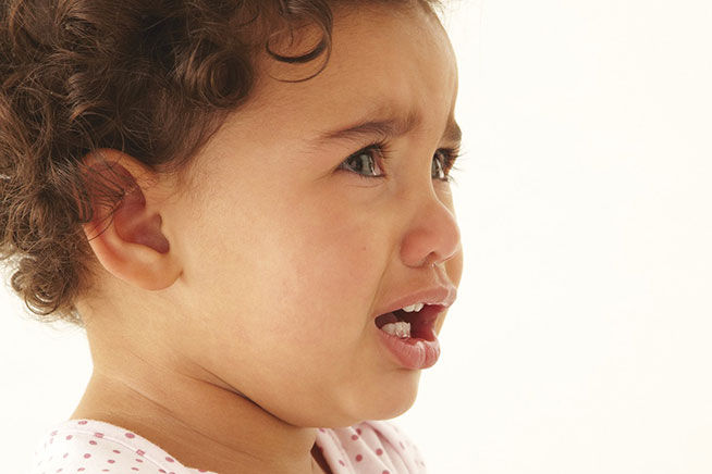 toddler with tears in his eyes