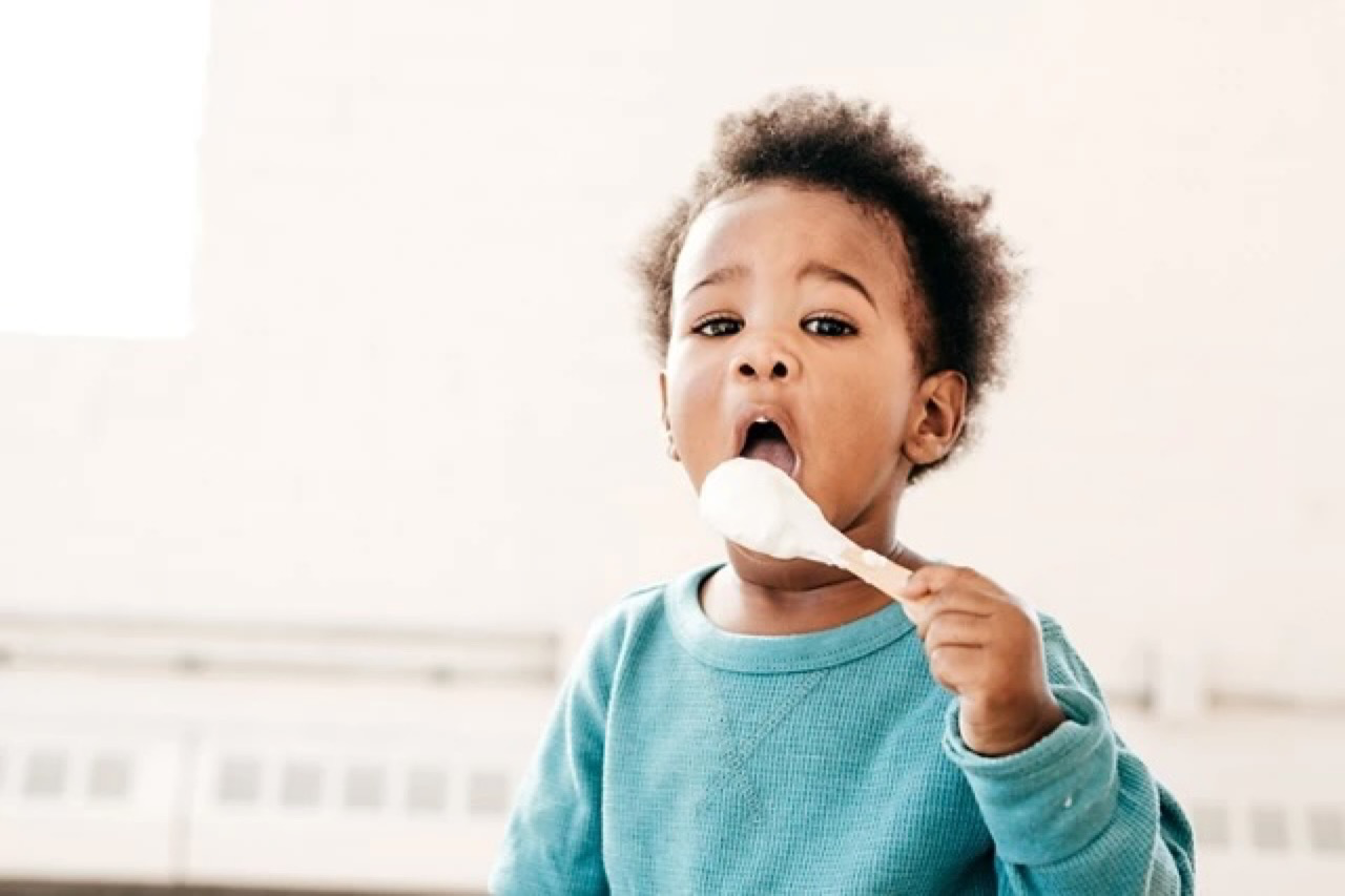 toddler with spon