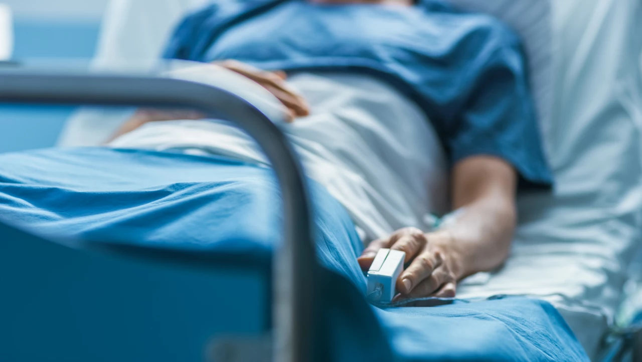 Person laying on a hospital bed