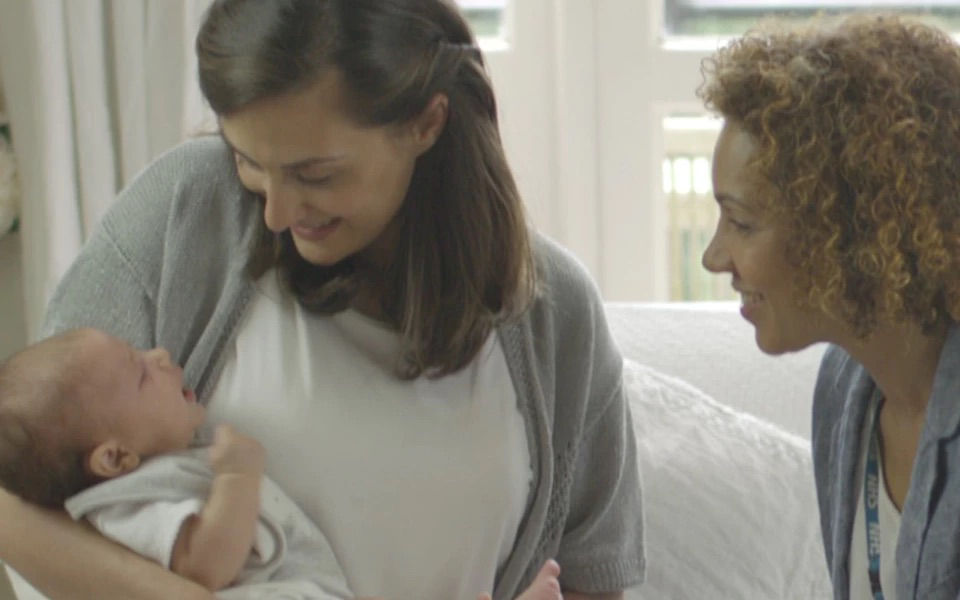 Two woman with baby