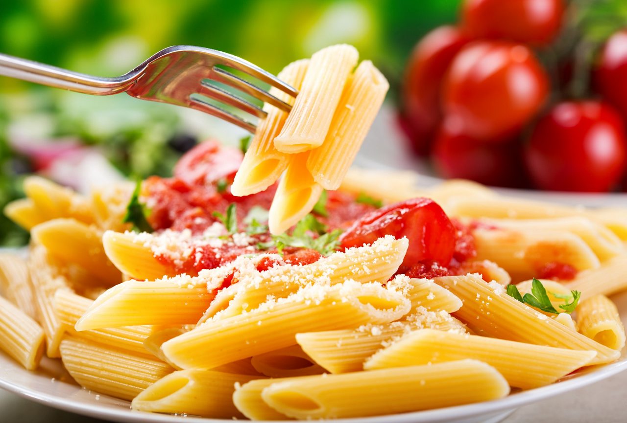 plate of penne pasta with tomato sauce