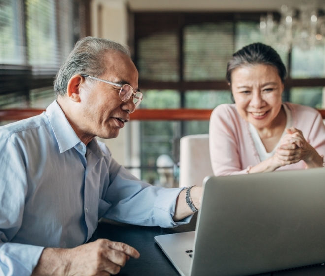 Asian couple using a computer