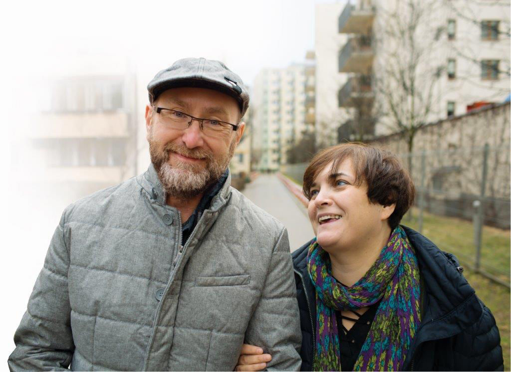 Couple out walking and smiling 