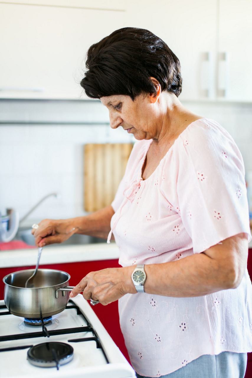 woman-cooking-on-hob