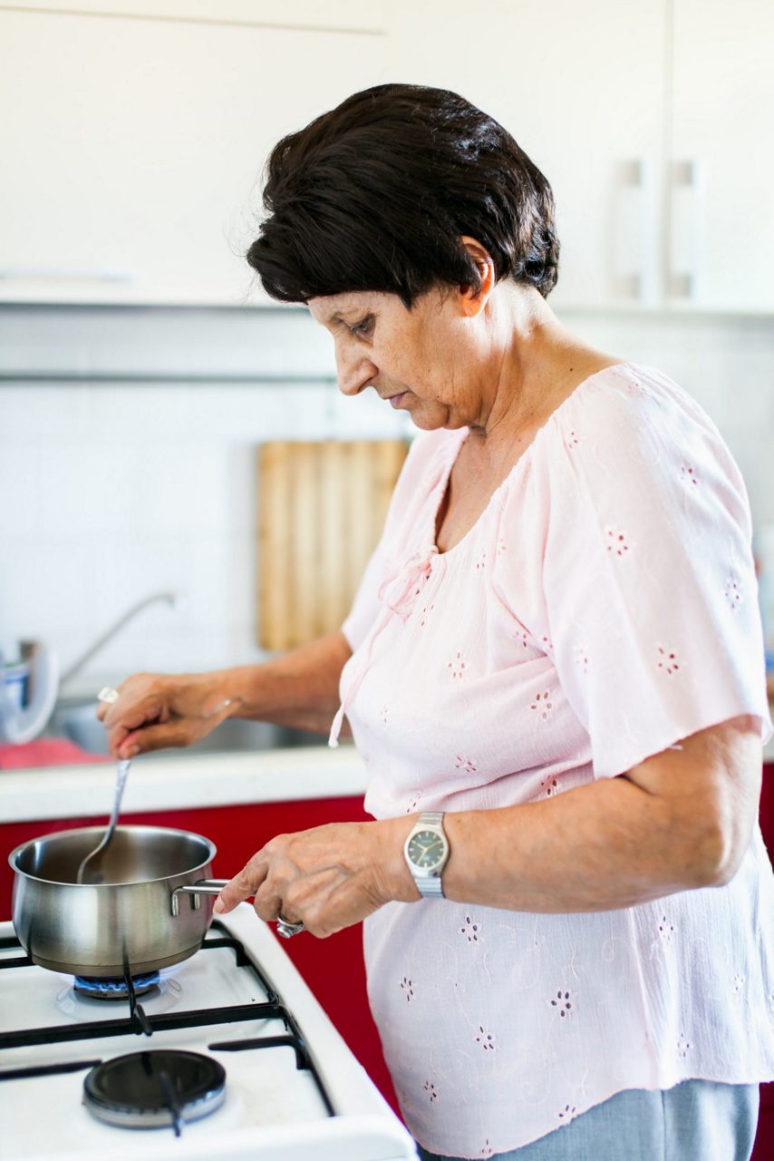 woman-cooking-on-hob