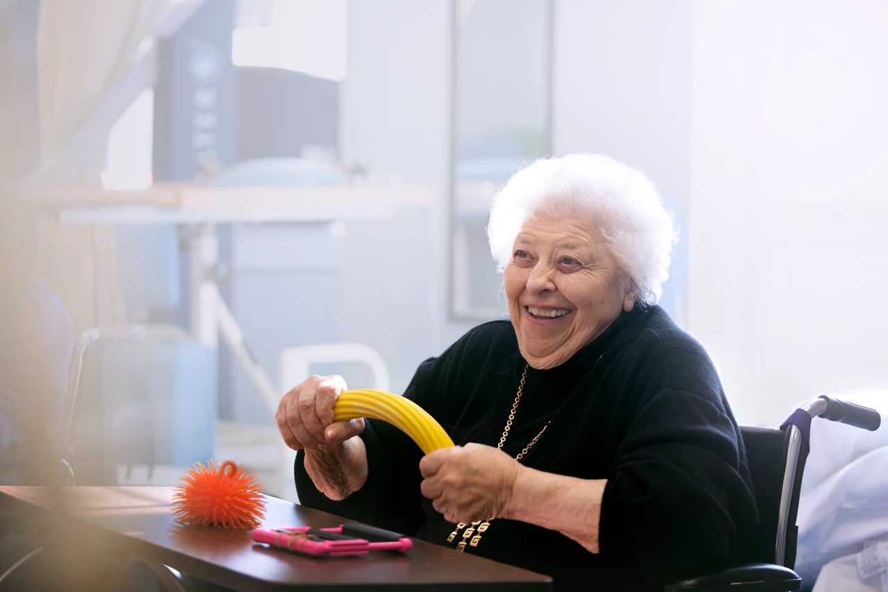 Senior lady doing hand streachings