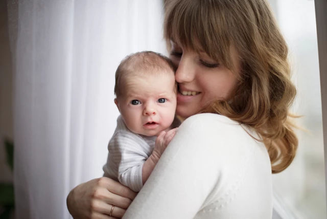 Young mum baby cuddles