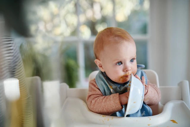 Baby eating from a bowl