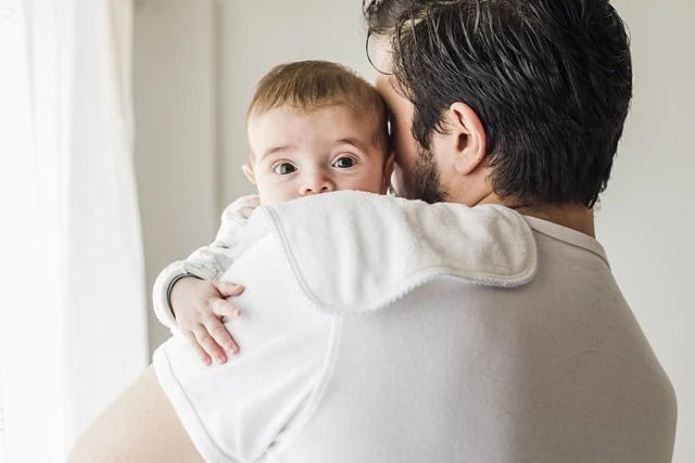 Baby in father's hands